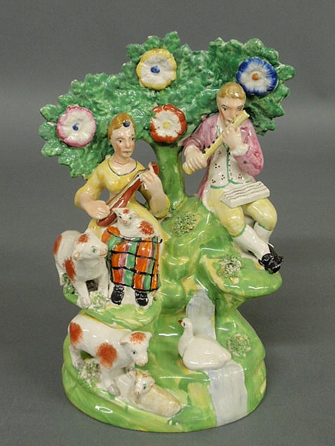 Appraisal: Staffordshire figural group of rural musicians and sheep c h