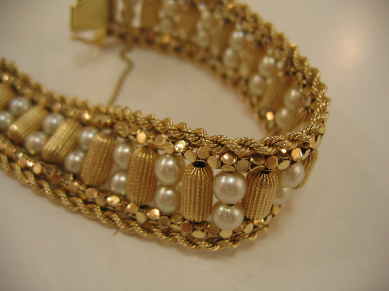 Appraisal: PEARL BRACELET k yellow gold with textured cylinder beads and