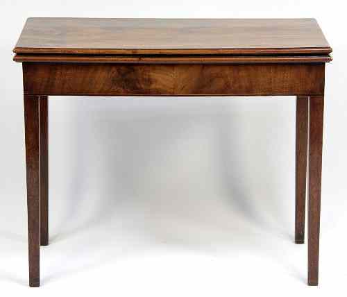 Appraisal: A George III mahogany tea table with plain frieze on