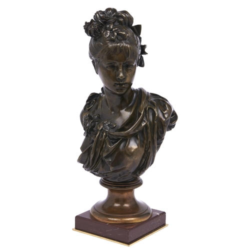 Appraisal: A bronze bust of a young woman cast from a