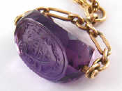 Appraisal: A carat gold amethyst pendant seal with engraved crest approx