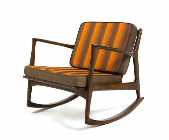 Appraisal: A Danish Rocking Chair Selig having a birch frame with