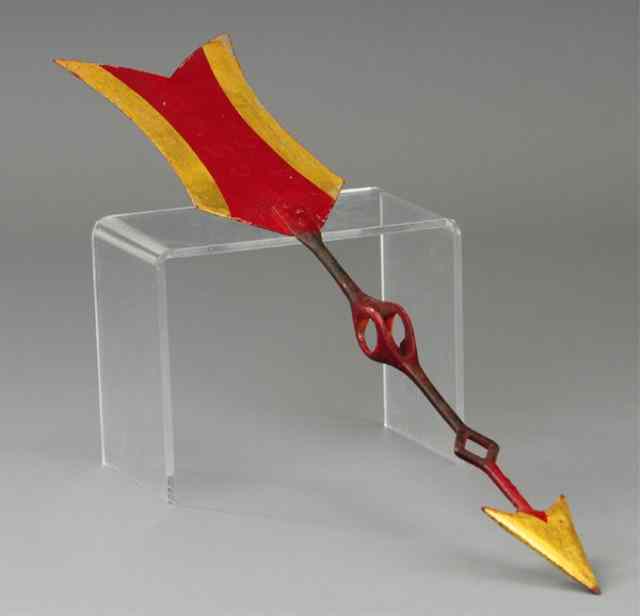 Appraisal: CAST IRON ARROW Painted in red and gold makes a