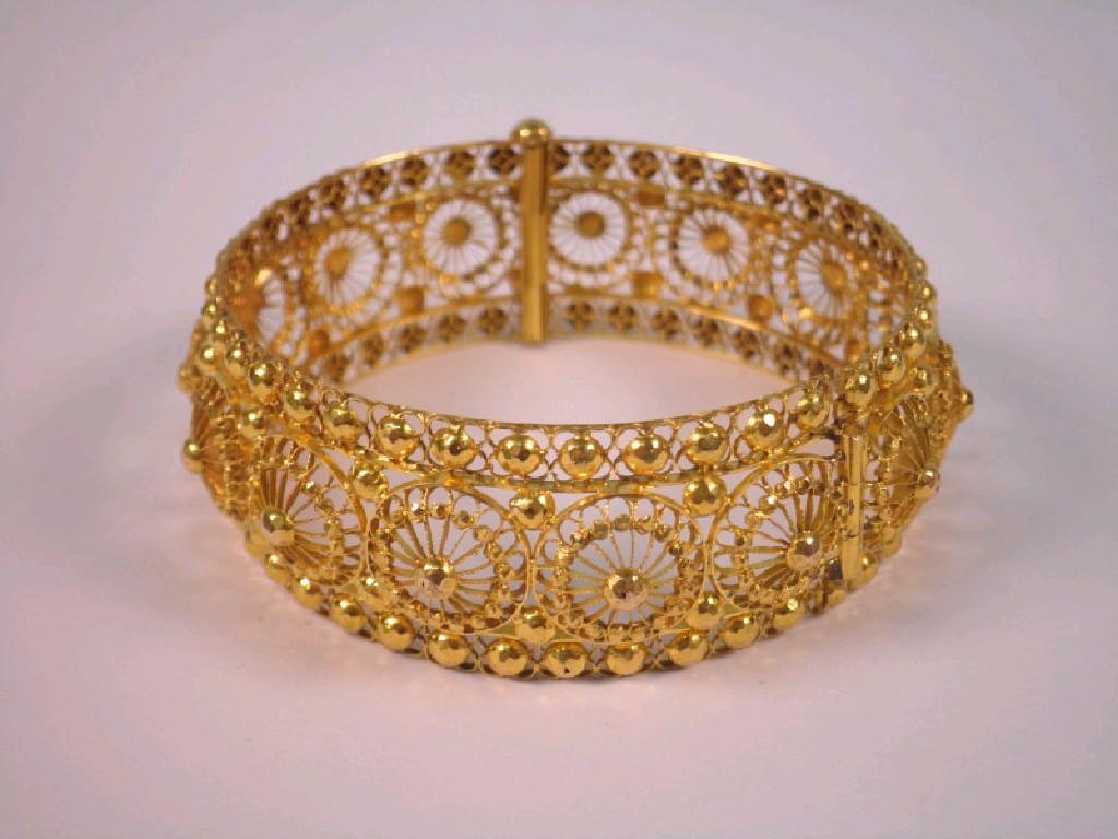 Appraisal: An Asian filigree hinged bangle yellow metal g