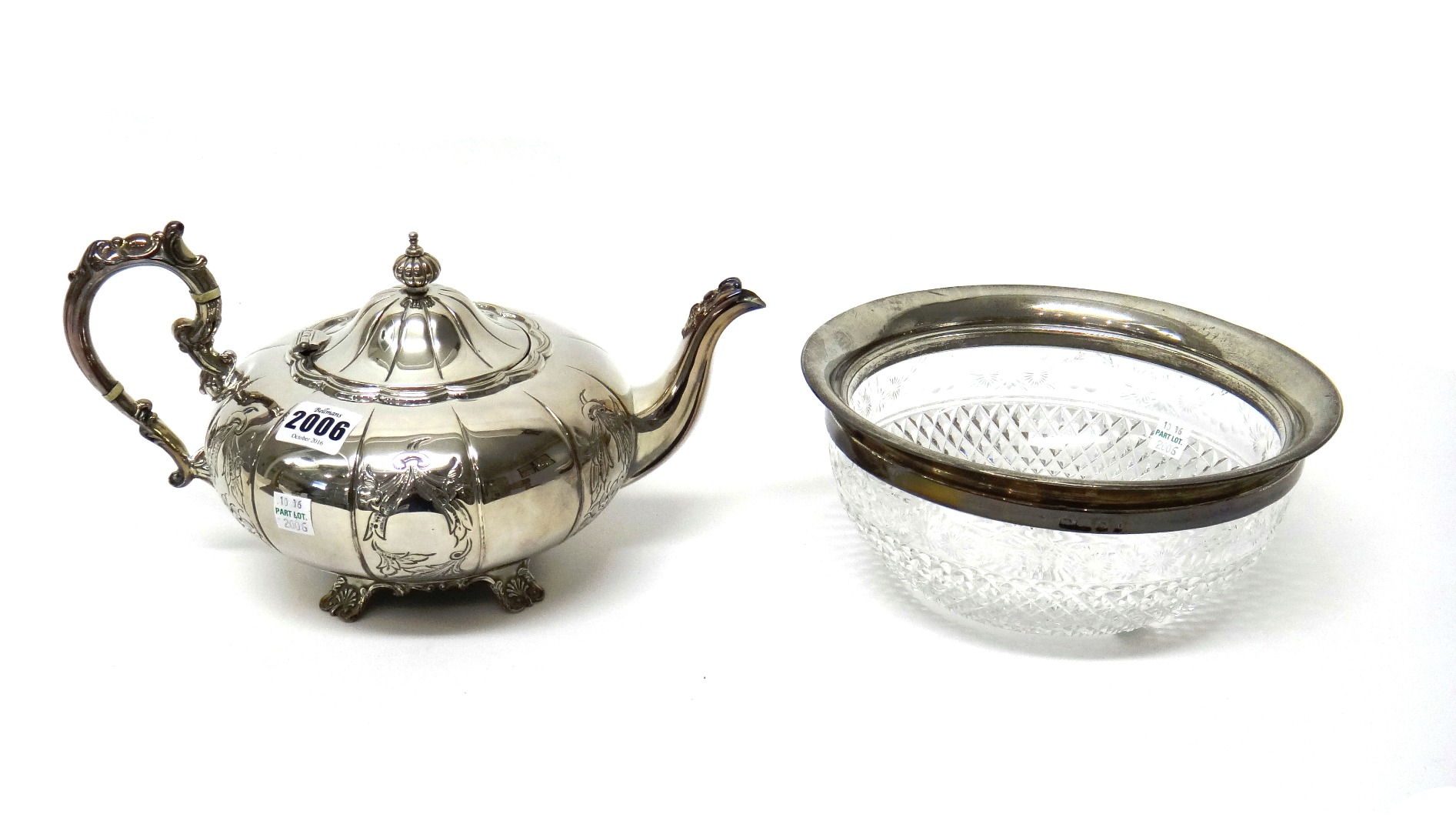 Appraisal: A silver teapot of compressed melon fluted form with a