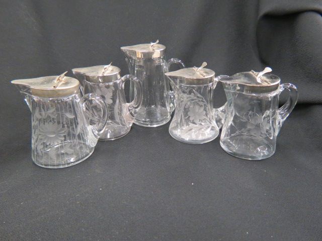 Appraisal: Collection of Crystal Syrup Pitchers most with etched flowers circa