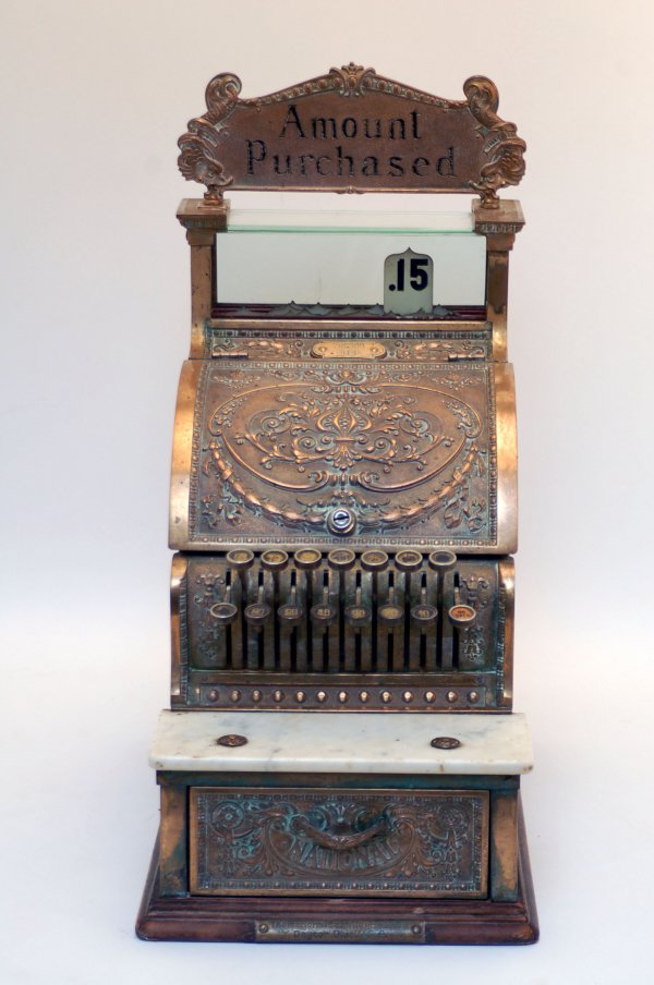 Appraisal: Late th century brass cash register with a white marble