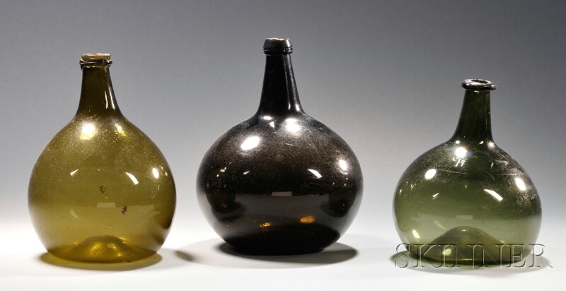 Appraisal: Three Colored Free-blown Glass Chestnut Bottles - the largest probably