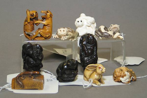 Appraisal: Twelve contemporary ivory wood and stag antler netsuke Including six