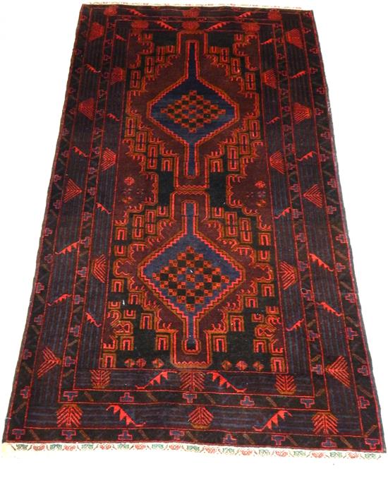 Appraisal: RUG Baluch '' x '' red field with navy medium