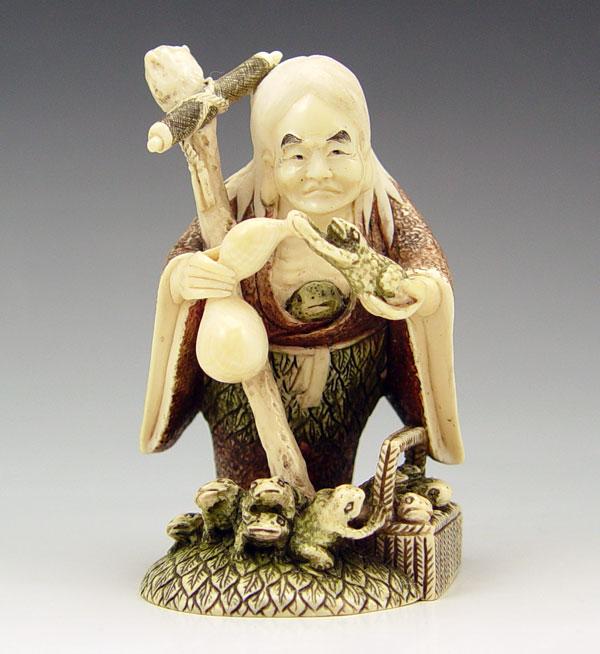 Appraisal: CHINESE CARVED IVORY MAN WITH TOADS Figure of elderly man