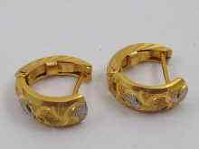 Appraisal: A pair of yellow metal tests ct gold hoop earrings