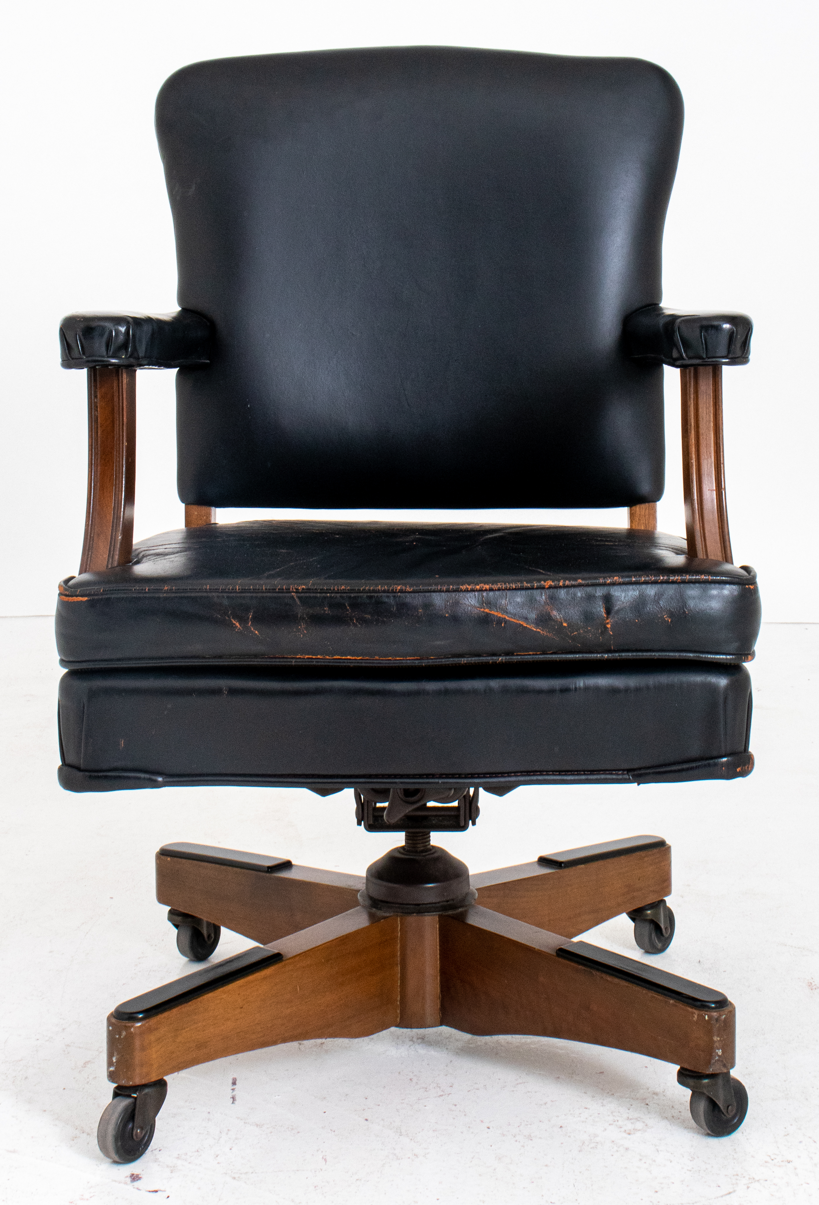 Appraisal: TRADITIONAL BLACK LEATHER SWIVEL OFFICE CHAIR Traditional black leather-upholstered back