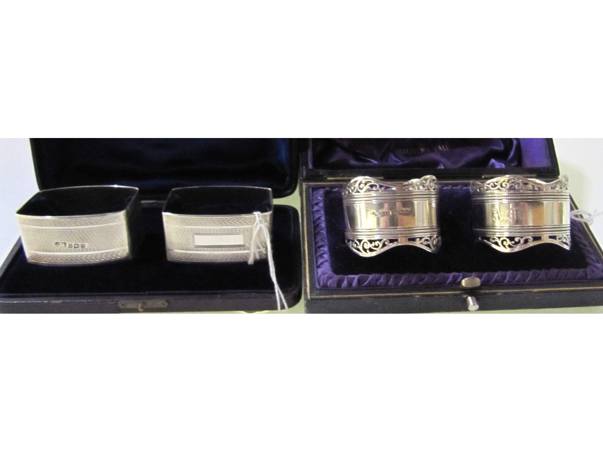 Appraisal: A lot comprising two cased pairs of silver napkin rings