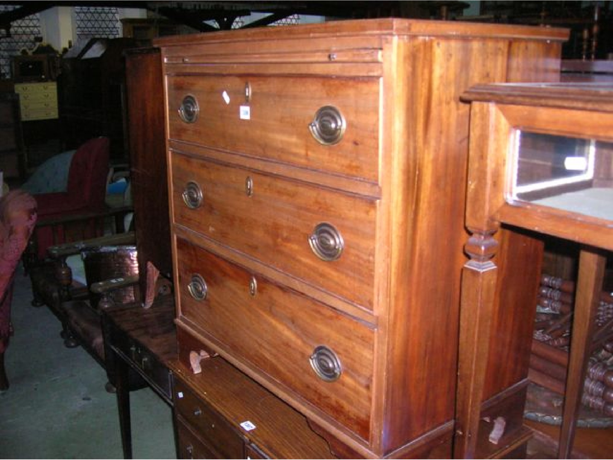 Appraisal: A small th century mahogany chest of three long graduated