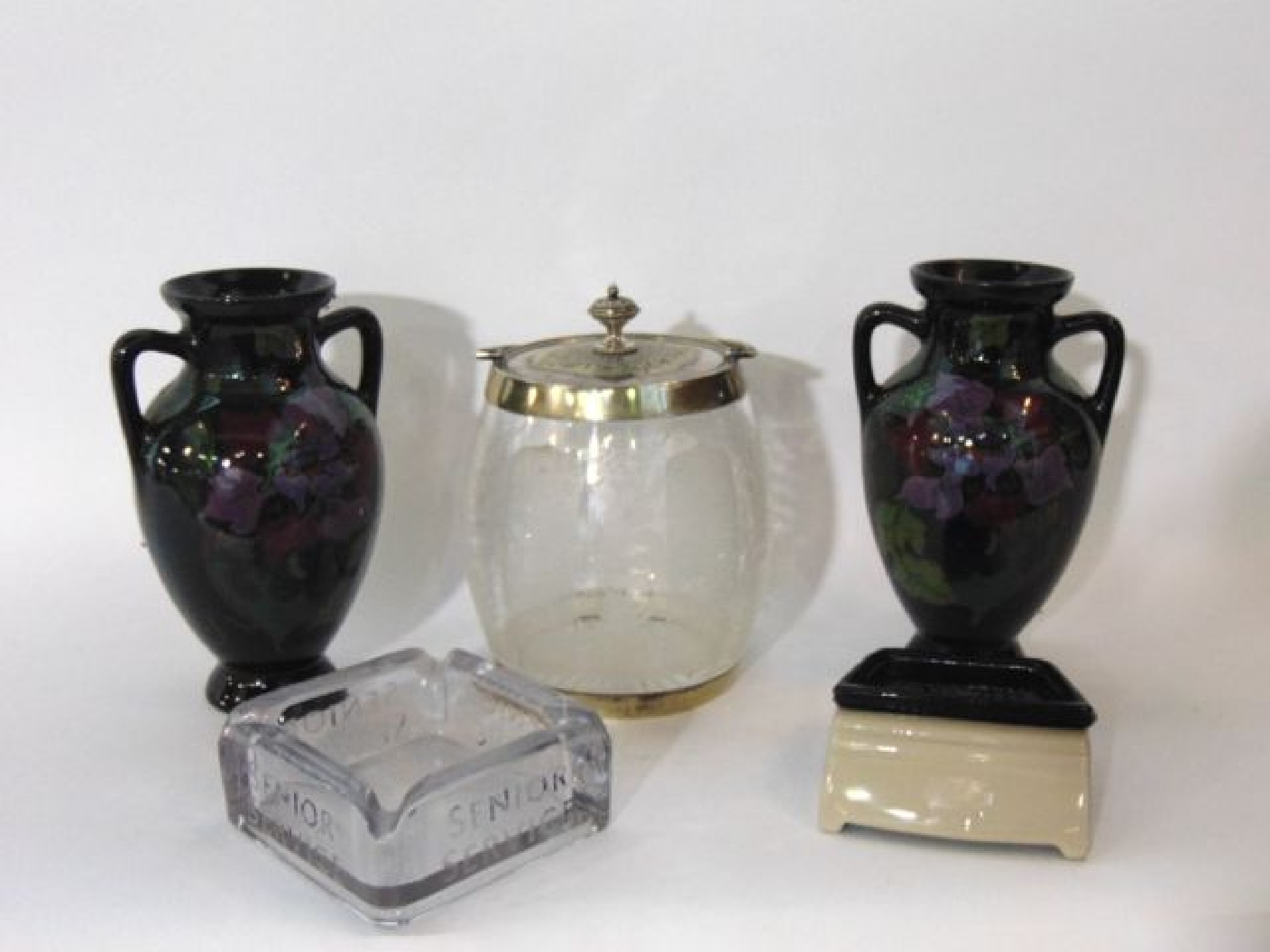 Appraisal: A pair of Gouda -handled vases with purple and green