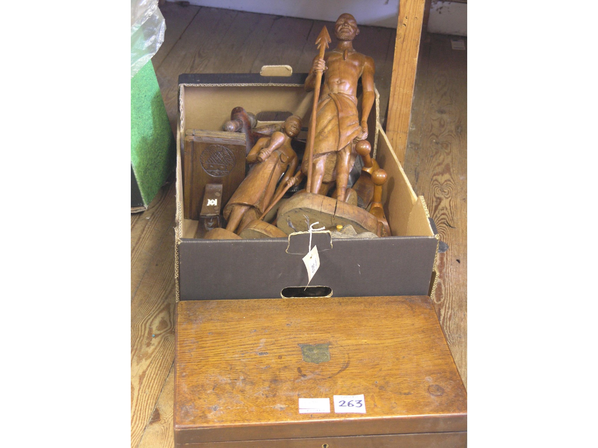 Appraisal: A pair of carved wood book-ends each in the form