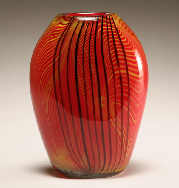 Appraisal: Murano red cased art glass vase Yellow feathering and brown