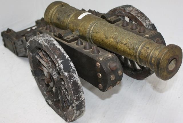 Appraisal: ORNATE MINIATURE BRASS CANNON ON CARRIAGE WITHAMERICAN EAGLE MOTIF LONG