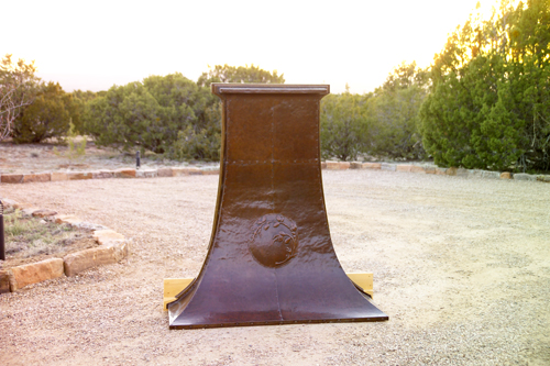 Appraisal: GUSTAV STICKLEY Hammered copper fireplace hood embossed with a pine