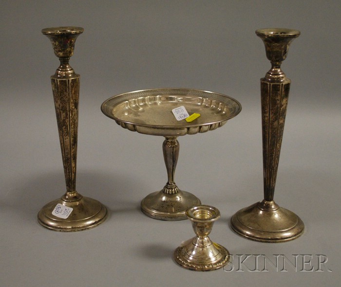 Appraisal: Four Sterling Weighted Table Items a footed compote a pair