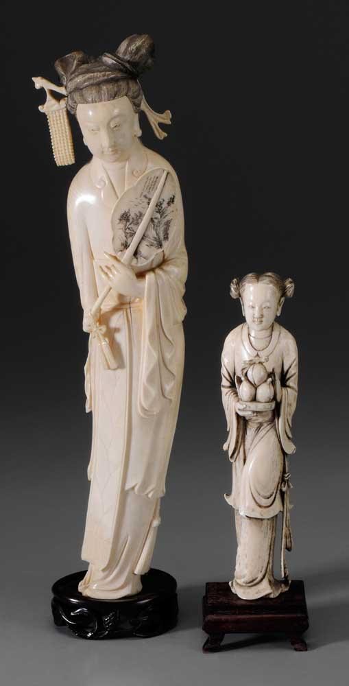 Appraisal: Two Carved Ivory Ladies Chinese one holding plate of peaches