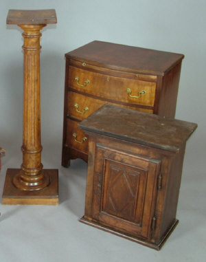 Appraisal: A stained wood hanging cupboard the moulded frieze above panelled