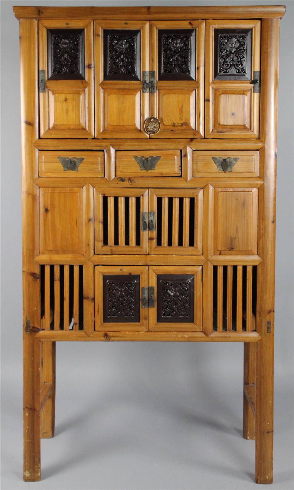 Appraisal: CHINESE BAMBOO CABINET WITH EBONIZED AND FLORAL CARVED DOORS the