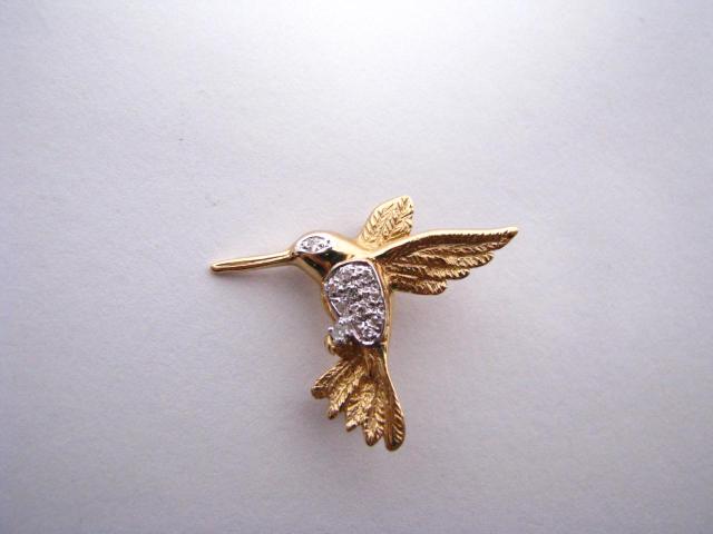 Appraisal: k yellow gold humming bird pin with diamond accents