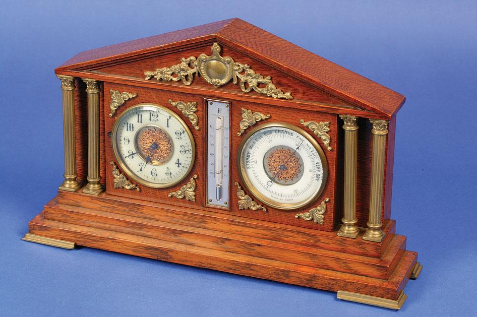 Appraisal: AN EDWARDIAN OAK CASED CLOCK with thermometer and barometer the