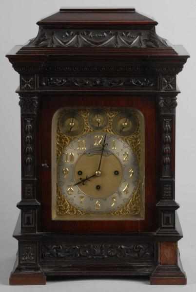 Appraisal: Large Carved Mahogany Bracket Clock Description Made for Bailey Banks