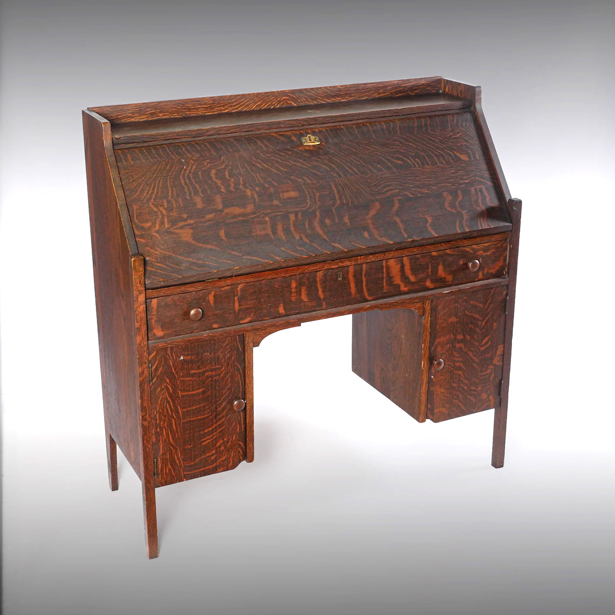 Appraisal: ARTS AND CRAFTS STYLE SLANT FRONT DESK Oak slant front