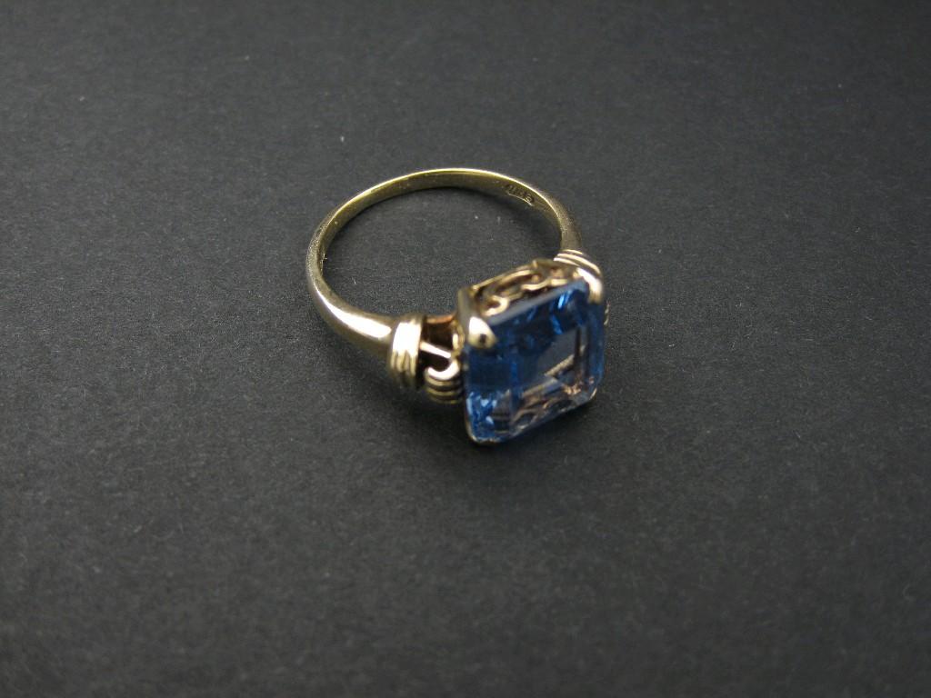 Appraisal: A ct gold Dress Ring claw-set step-cut synthetic blue stone