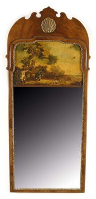 Appraisal: A mahogany and parcel gilt wall mirror the frieze with