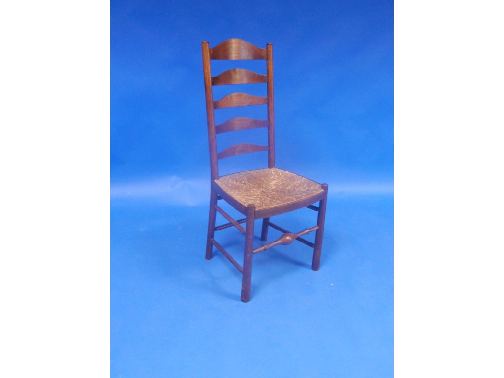 Appraisal: A thC elm ladder back chair with rush seat