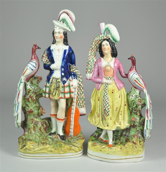 Appraisal: Staffordshire Figural Pair th Century Scotsman and lady with pea