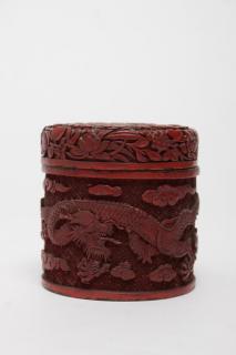 Appraisal: Chinese Cinnabar Enamel Jar with Dragon Motif Asian cinnabar around