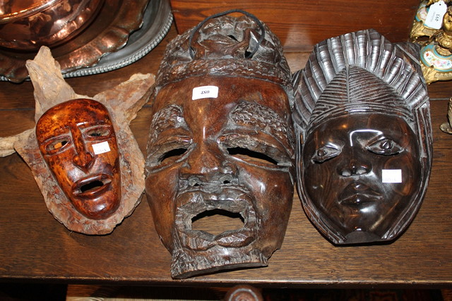 Appraisal: A PAIR OF MALAYSIAN CARVED COROMANDEL WOOD FACE MASKS x