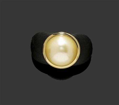 Appraisal: EBONY AND PEARL RING Large decorative ebony ring the top