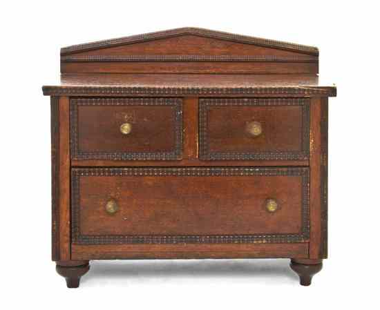 Appraisal: A Tramp Art Diminutive Chest of Drawers having a rectangular