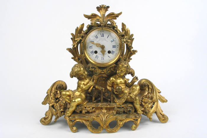 Appraisal: FRENCH GILT BRONZE FIGURAL MANTEL CLOCK in the baroque manner