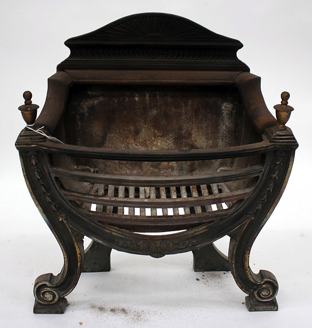 Appraisal: A GEORGIAN STYLE CAST IRON FIRE GRATE with turned urn