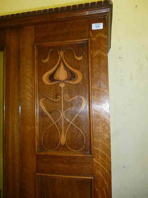 Appraisal: AN ARTS CRAFTS OAK WARDROBE with dogtooth moulding to the