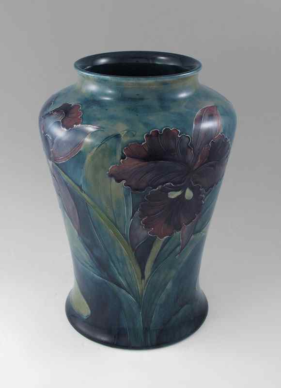 Appraisal: MOORCROFT PURPLE ORCHID VASE Deepest purple orchid flowers with mottled