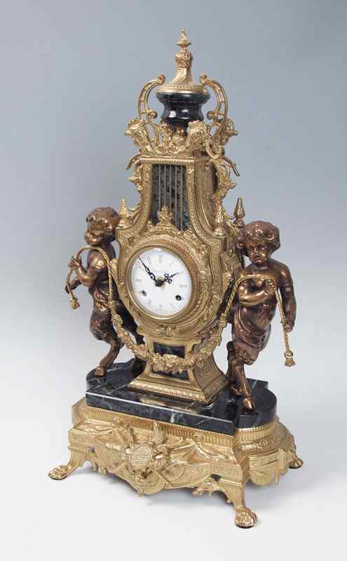 Appraisal: IMPERIAL FIGURAL MANTLE CLOCK Figural pan children cast metal body