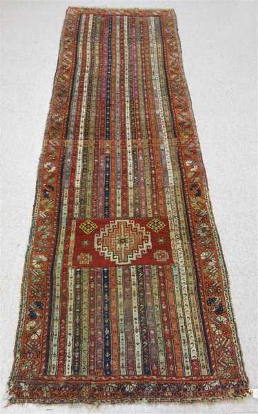 Appraisal: SEMI-ANTIQUE TURKISH TRIBAL RUNNER repeating stripe design with rectangular panel