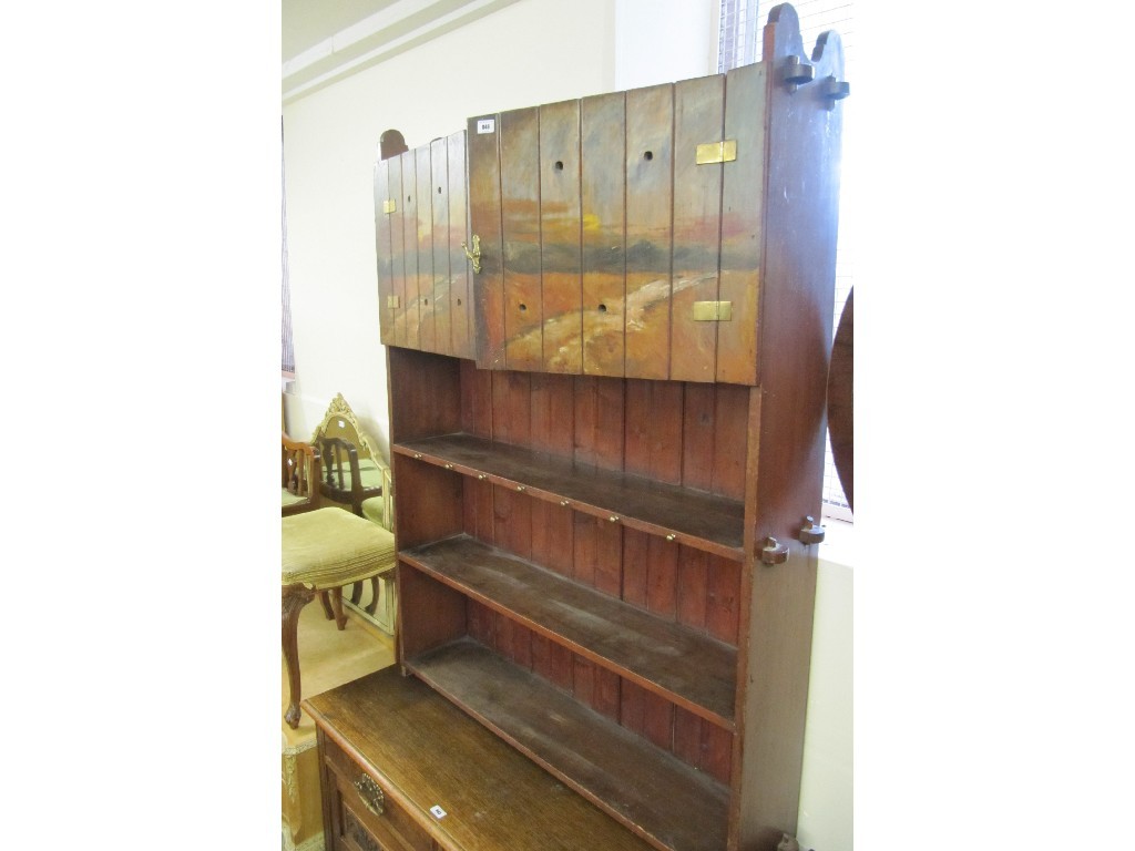 Appraisal: Victorian stained wood bookcase with two painted hinged doors