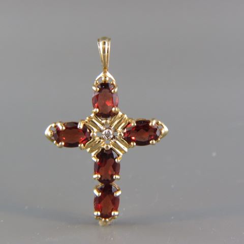 Appraisal: Garnet Diamond Cross fiery gems and one small diamond in