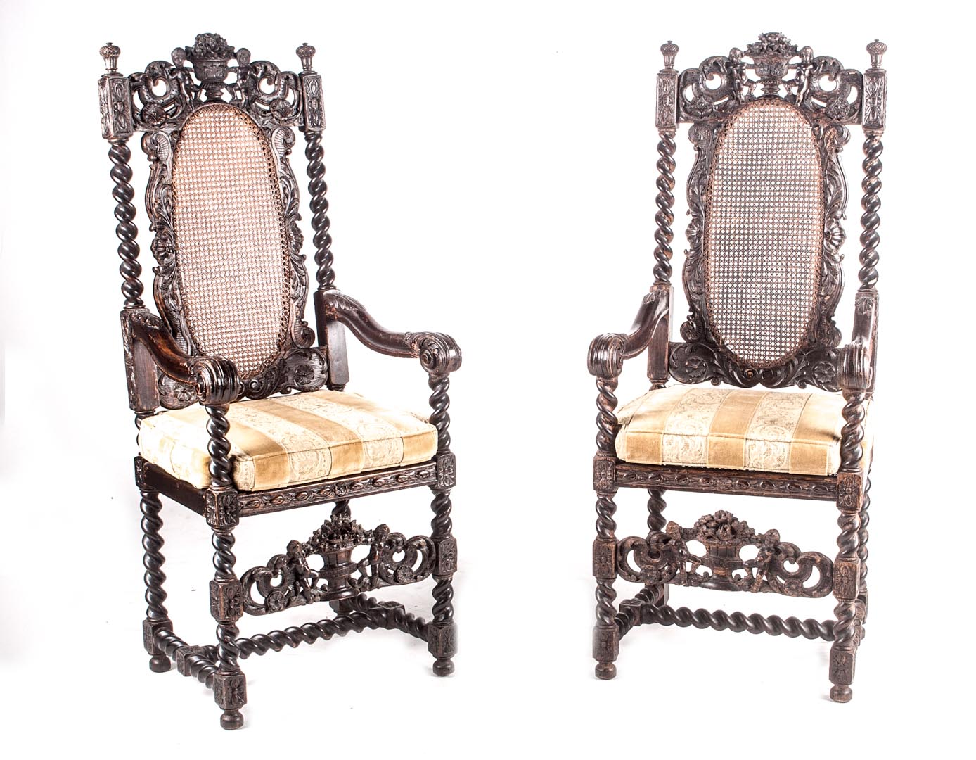 Appraisal: Pair of Jacobean style oak armchairs th century caned backs