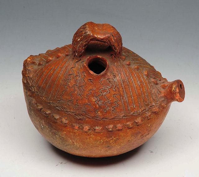 Appraisal: A FIJIAN POTTERY WATER VESSEL with ring handle and incised